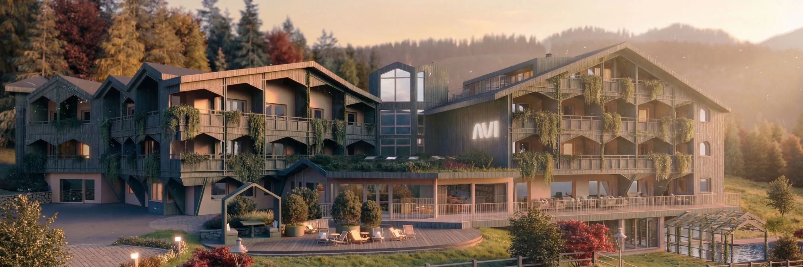 A modern mountain lodge with green balconies and large windows sits amidst lush trees and hills at sunset, exuding a serene, welcoming vibe.