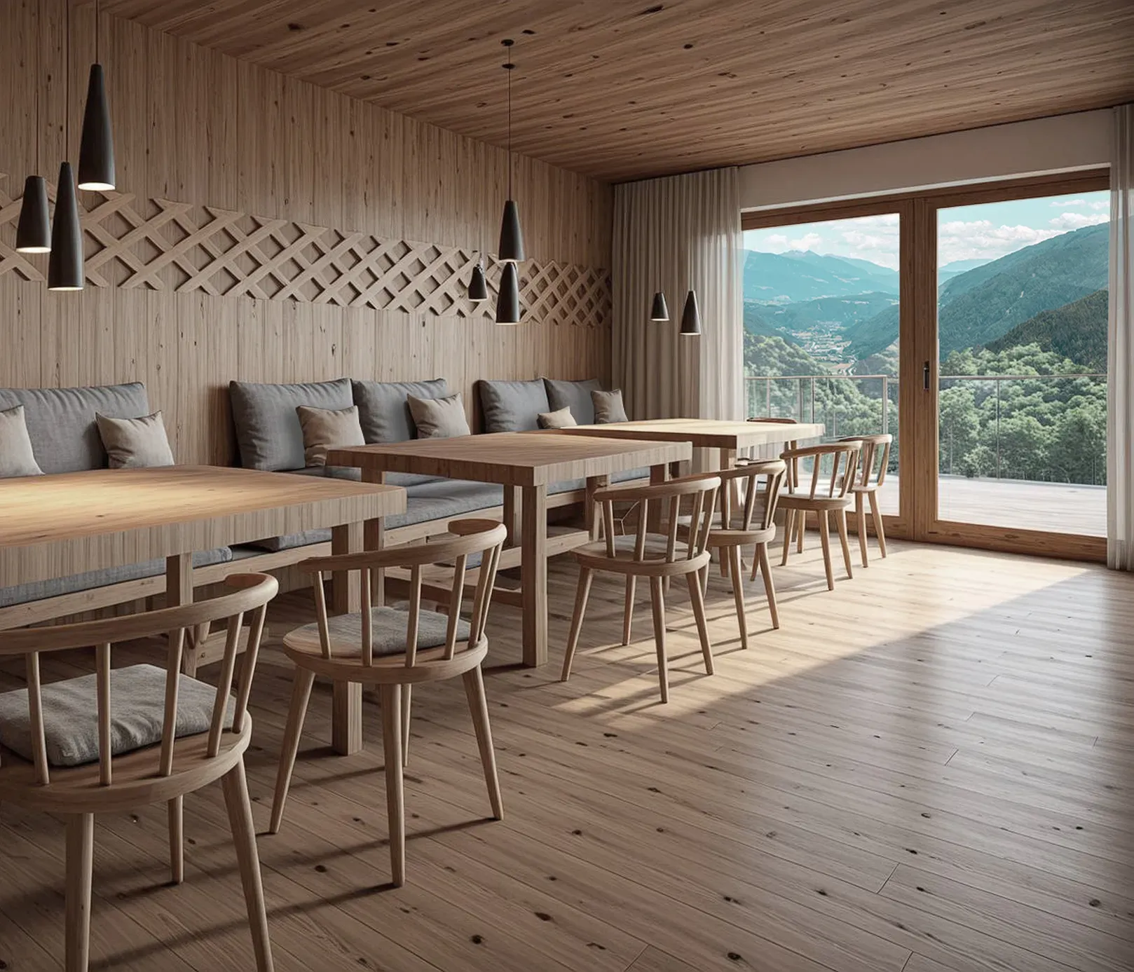 A cozy dining room with wooden walls, ceiling, and floor. Two rectangular tables are surrounded by cushioned benches and chairs. Large windows offer a scenic mountain view, creating a serene atmosphere.