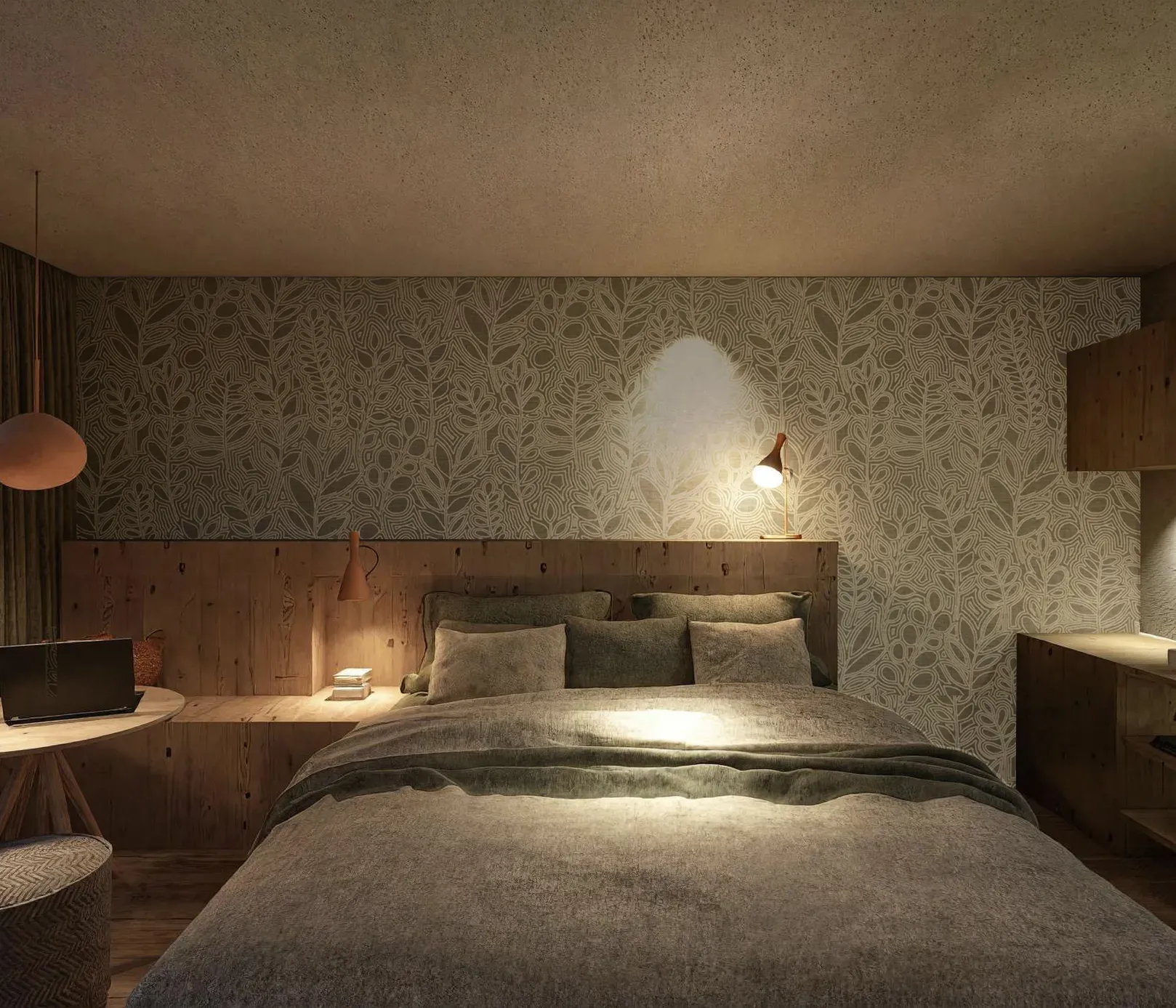 Cozy bedroom with a floral accent wall, soft lighting, and wooden furniture. A bed with gray bedding, laptop on a small table, and ambient warmth.