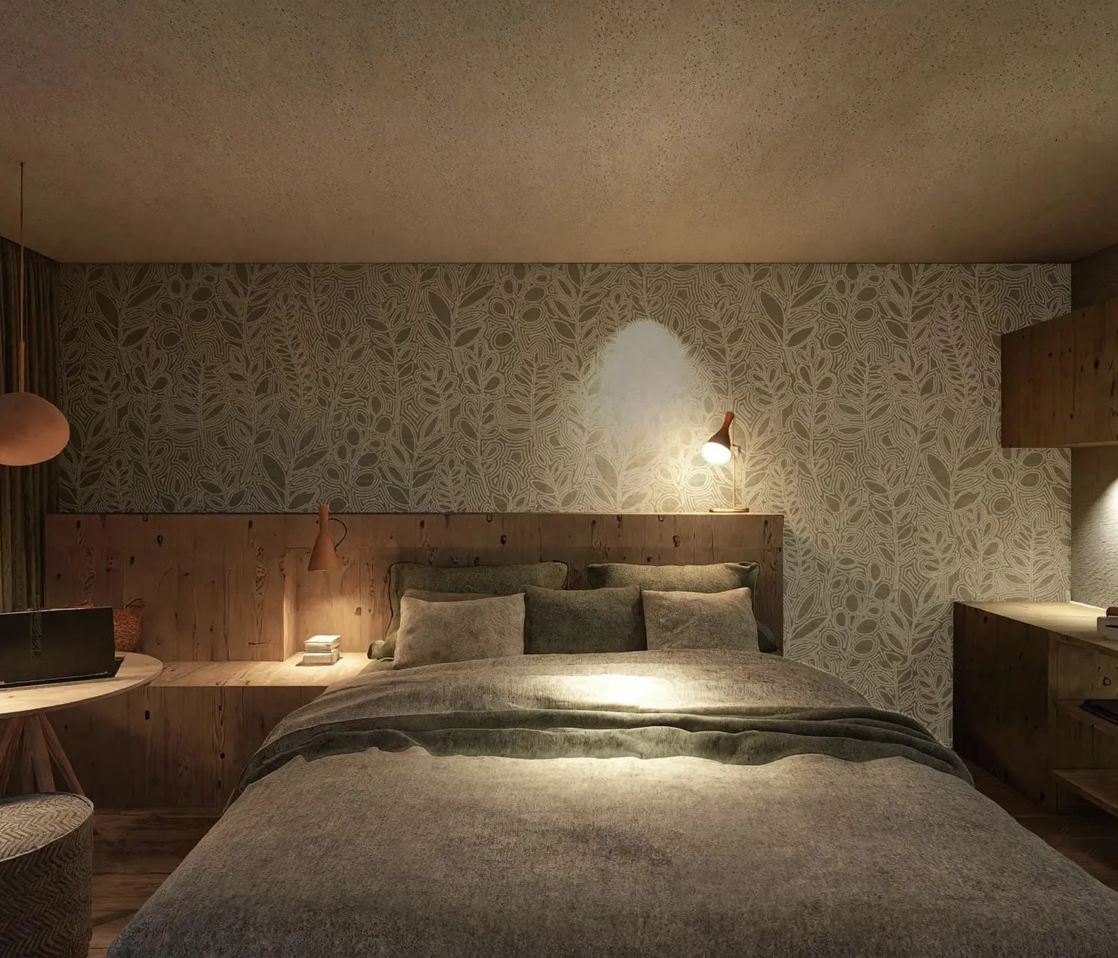 Cozy bedroom with a floral accent wall, soft lighting, and wooden furniture. A bed with gray bedding, laptop on a small table, and ambient warmth.