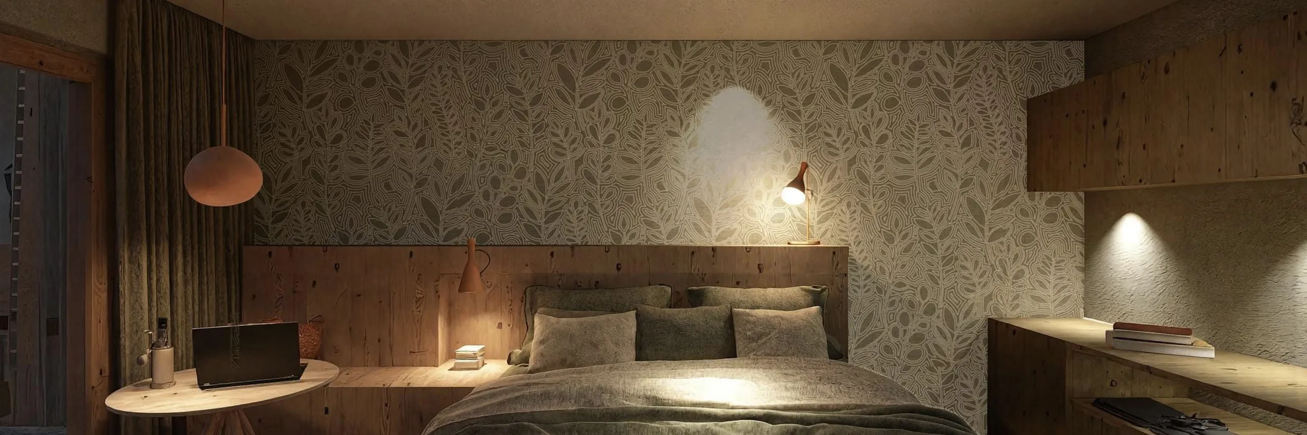 Cozy bedroom with a floral accent wall, soft lighting, and wooden furniture. A bed with gray bedding, laptop on a small table, and ambient warmth.