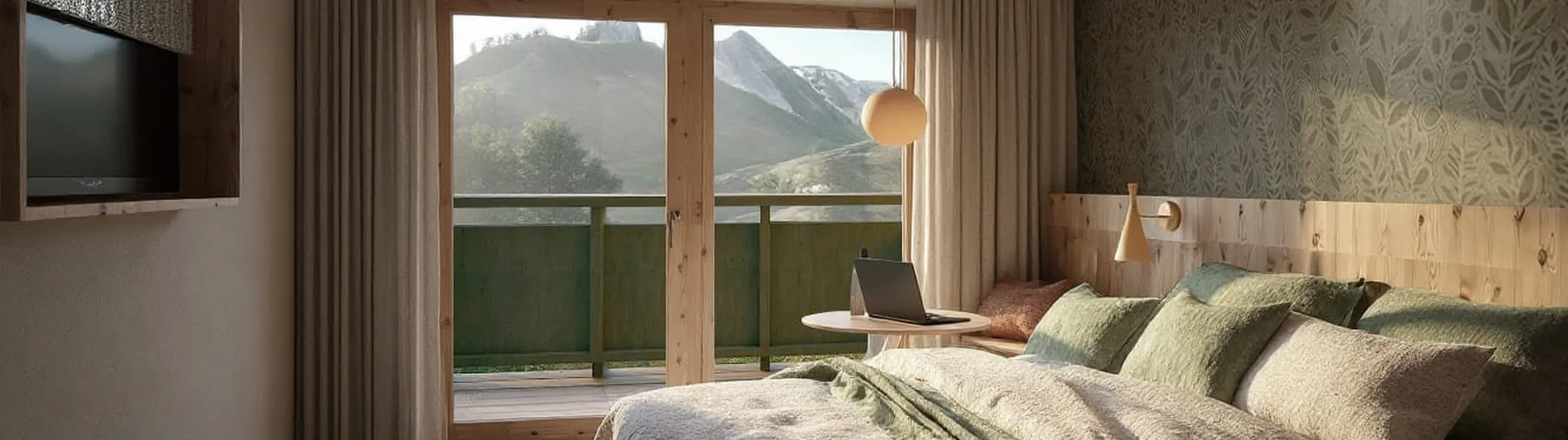 Cozy bedroom with a large bed covered in green and beige linens. A laptop on a small table by the balcony overlooks mountains. Soft lighting, wooden decor.